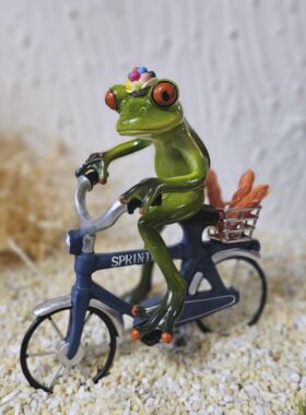 Gl&uuml;cksfrosch B&auml;cker mit Fahrrad