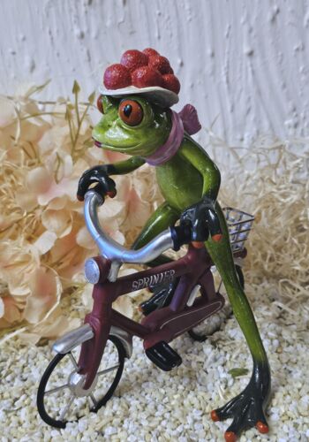 GLF2008 Gl&uuml;cksfrosch Fahrradfahrer mit rotem Fahrrad und gro&szlig;em Bollenhut