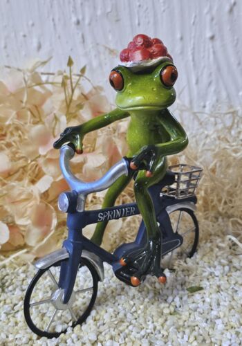 GLF2009 Gl&uuml;cksfrosch Fahrradfahrer mit blauem Fahrrad und gro&szlig;em Bollenhut